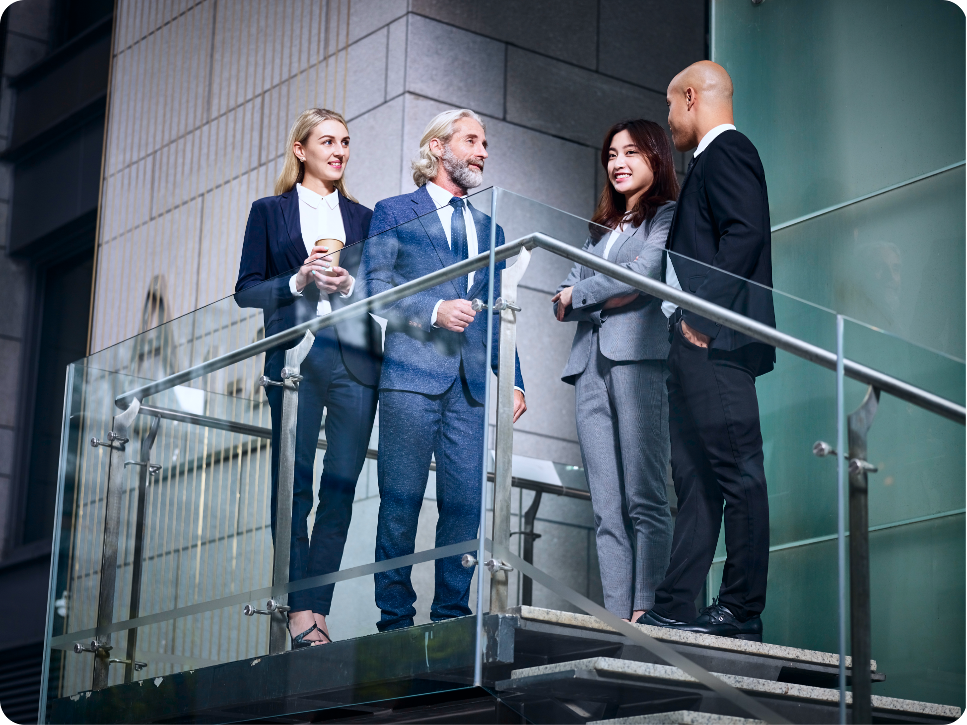 team-multiethnic-business-people-standing-talking-chatting-discussing-modern-office-building 1.png